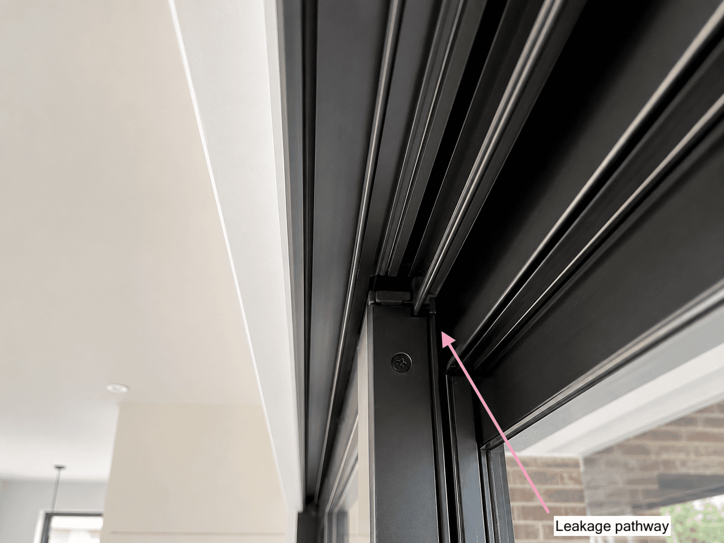 Air leakage detected at the head of the sliding door frame during a blower door depressurisation test at Willunga