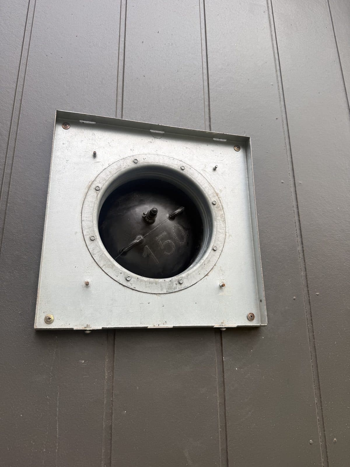 Inflatable bung inside an external MVHR vent, showing the fitting used to inflate it