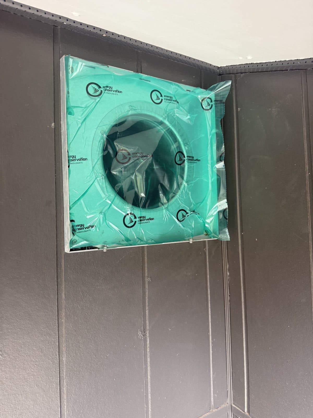 External MVHR vent sealed with duct seal tape for a blower door test